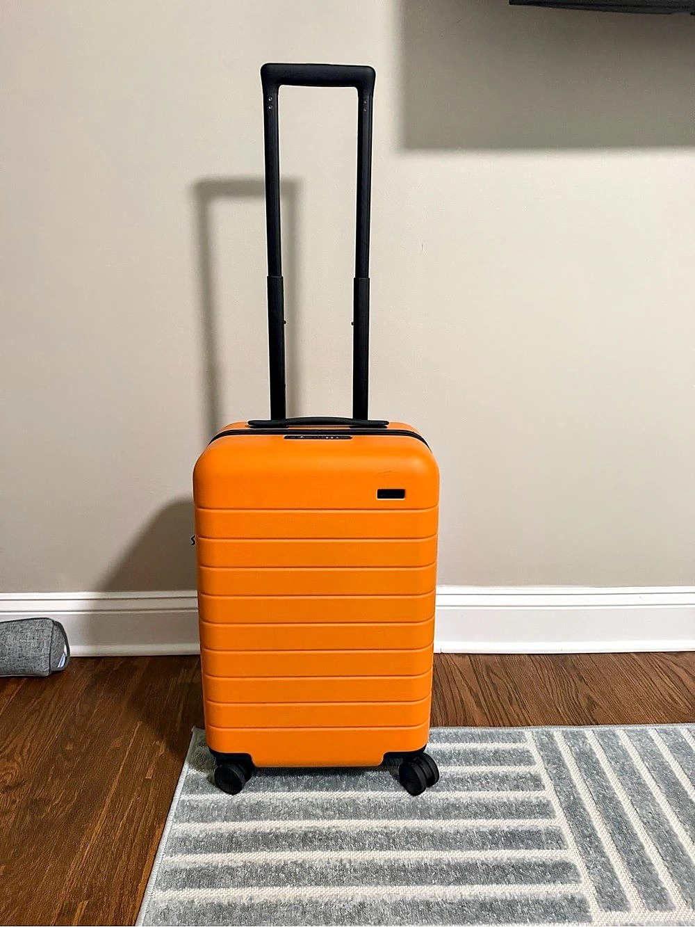 Away The Carry-On Orange & Black Rolling Carry-On Suitcase